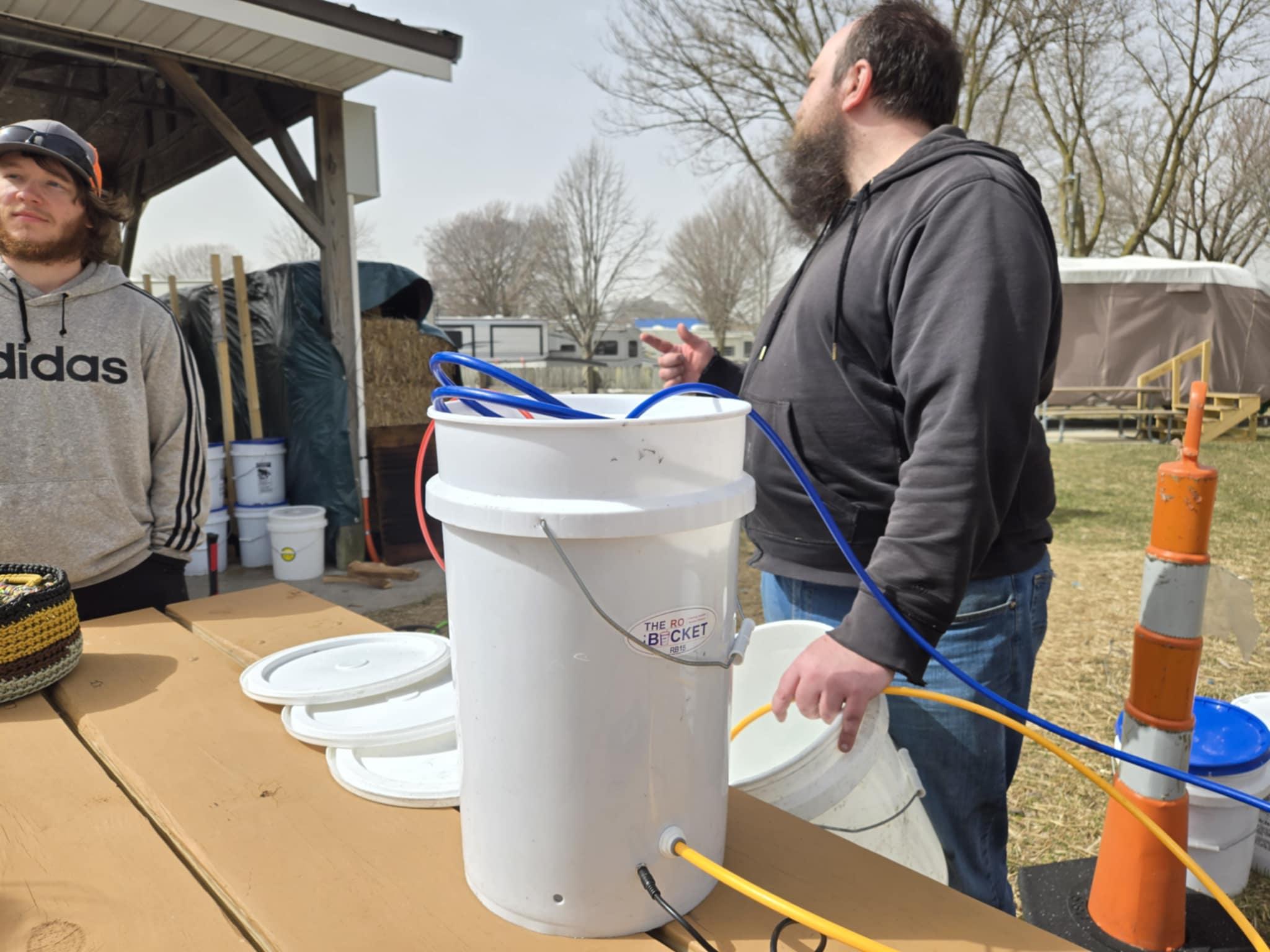 Nate concentrating some sap using the RO Bucket before it goes into the pan
