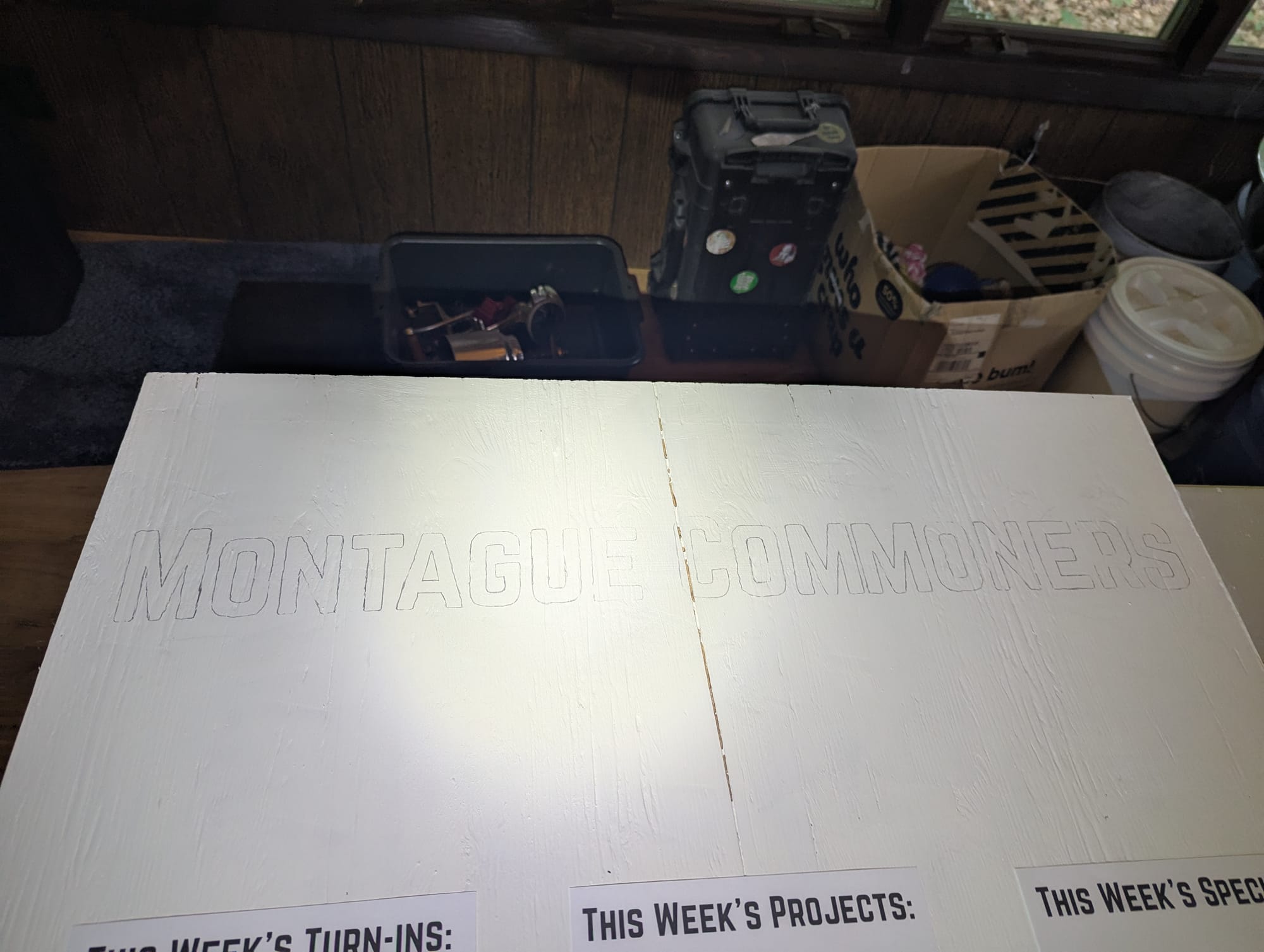 The sign board, with "Montague Commoners" outlined in graphite.