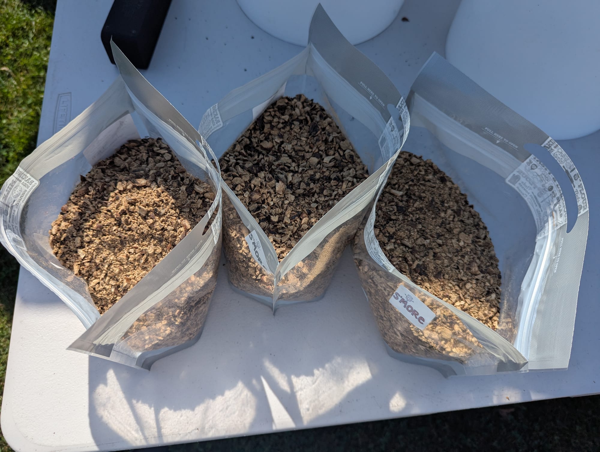 Three bags of coarsely ground acorns