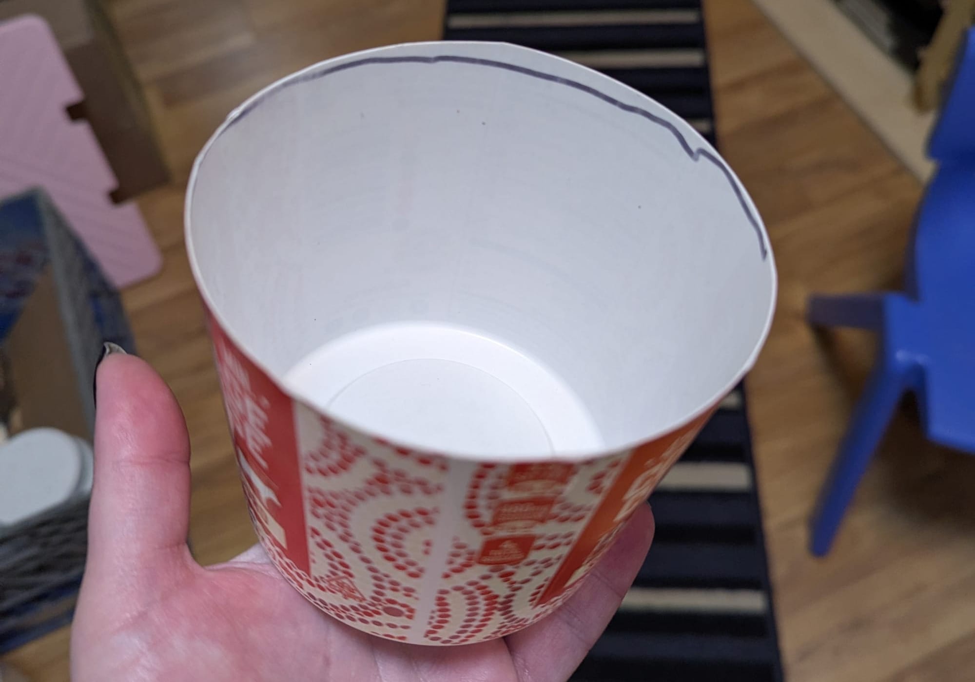 A plastic yogurt cup that has been cut down so that it holds 1 pound of black beans